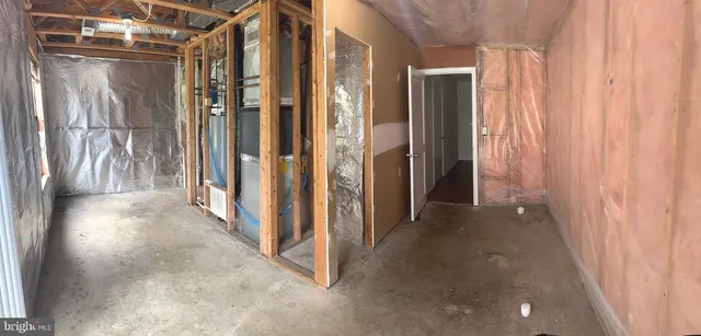 a view of a hallway with wooden shelves