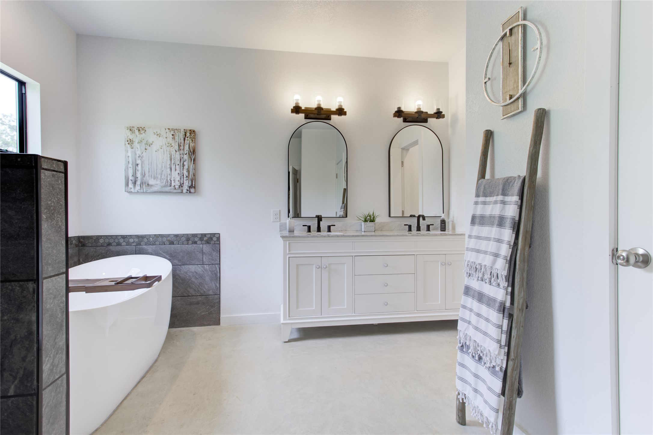 1215 Ridge Harbor Drive Spicewood, TX 78669 - Photo 19 of 39 a bathroom with a toilet sink and mirror