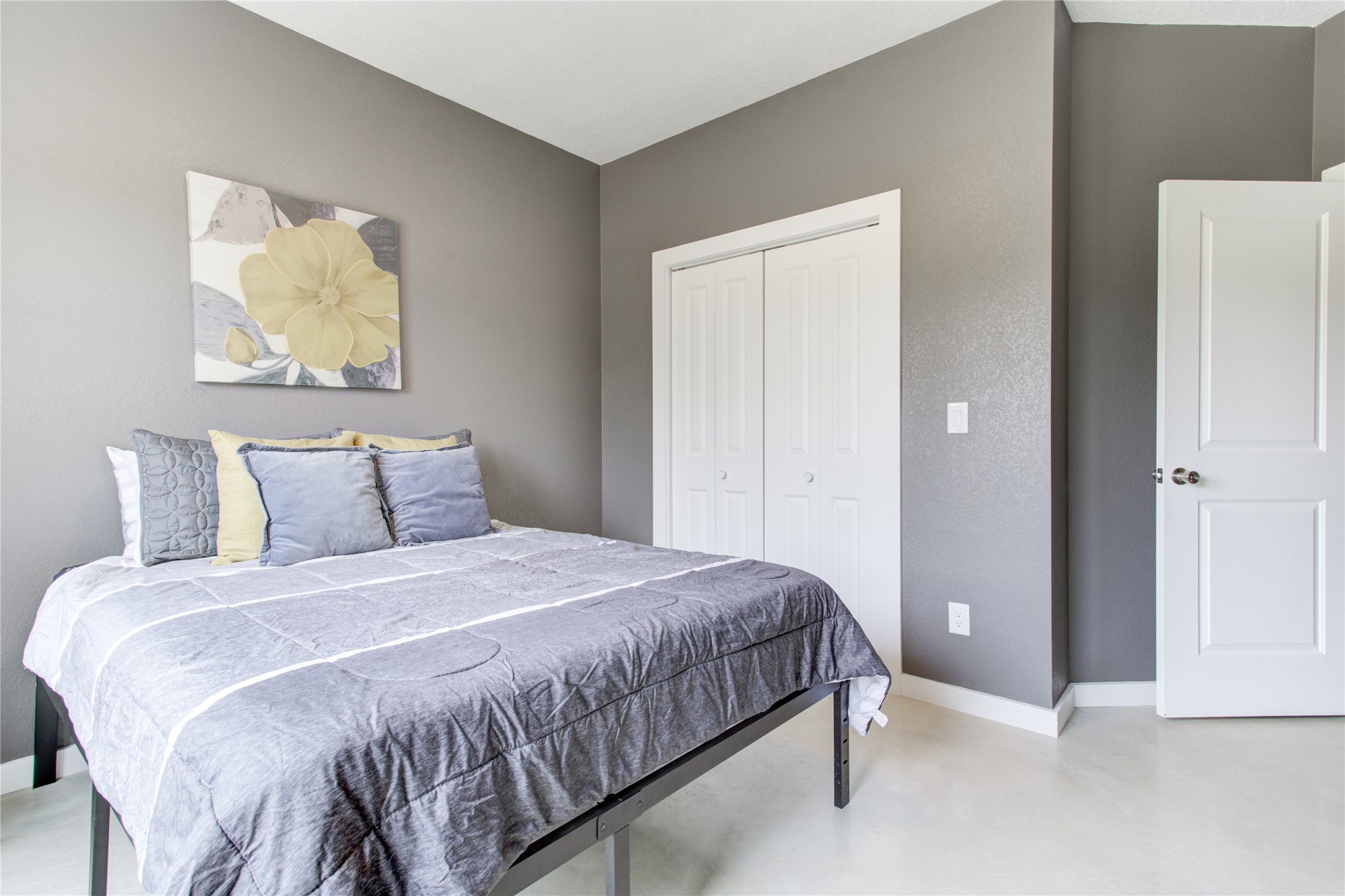 1215 Ridge Harbor Drive Spicewood, TX 78669 - Photo 26 of 39 a bedroom with a bed and wall painting