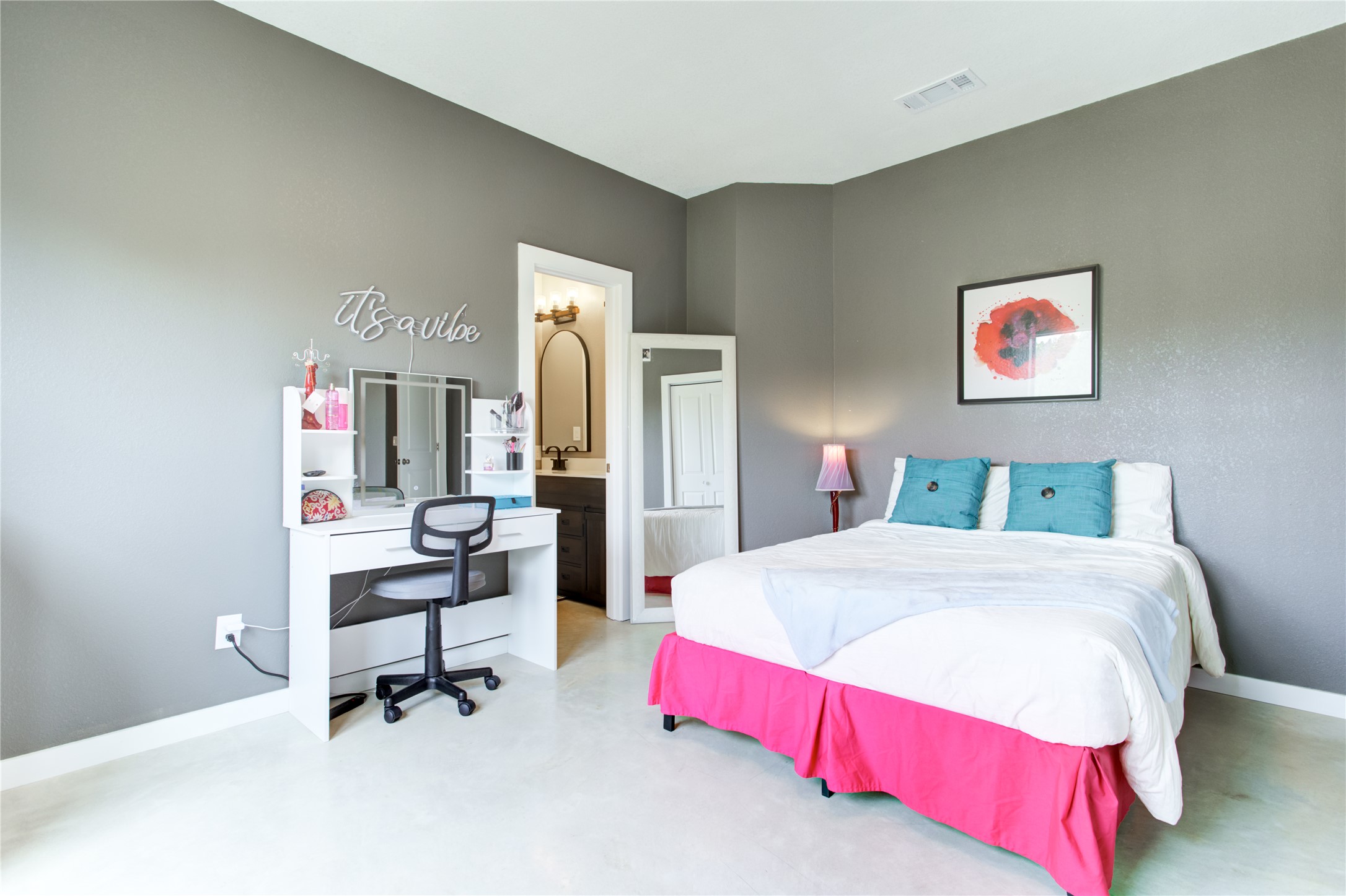 1215 Ridge Harbor Drive Spicewood, TX 78669 - Photo 28 of 39 a bedroom with a bed and a table in it