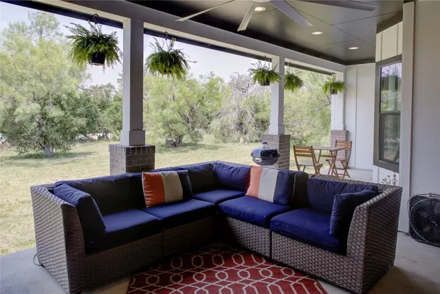 a view of a lake with couches and city view