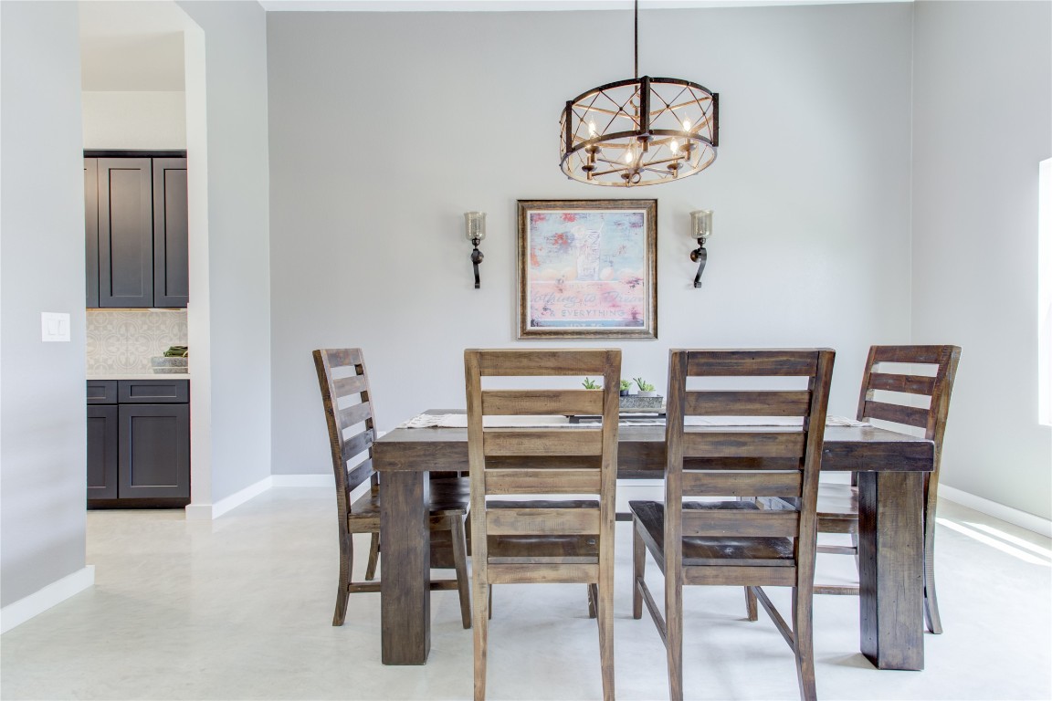 1215 Ridge Harbor Drive Spicewood, TX 78669 - Photo 6 of 39 a view of a dining room with furniture