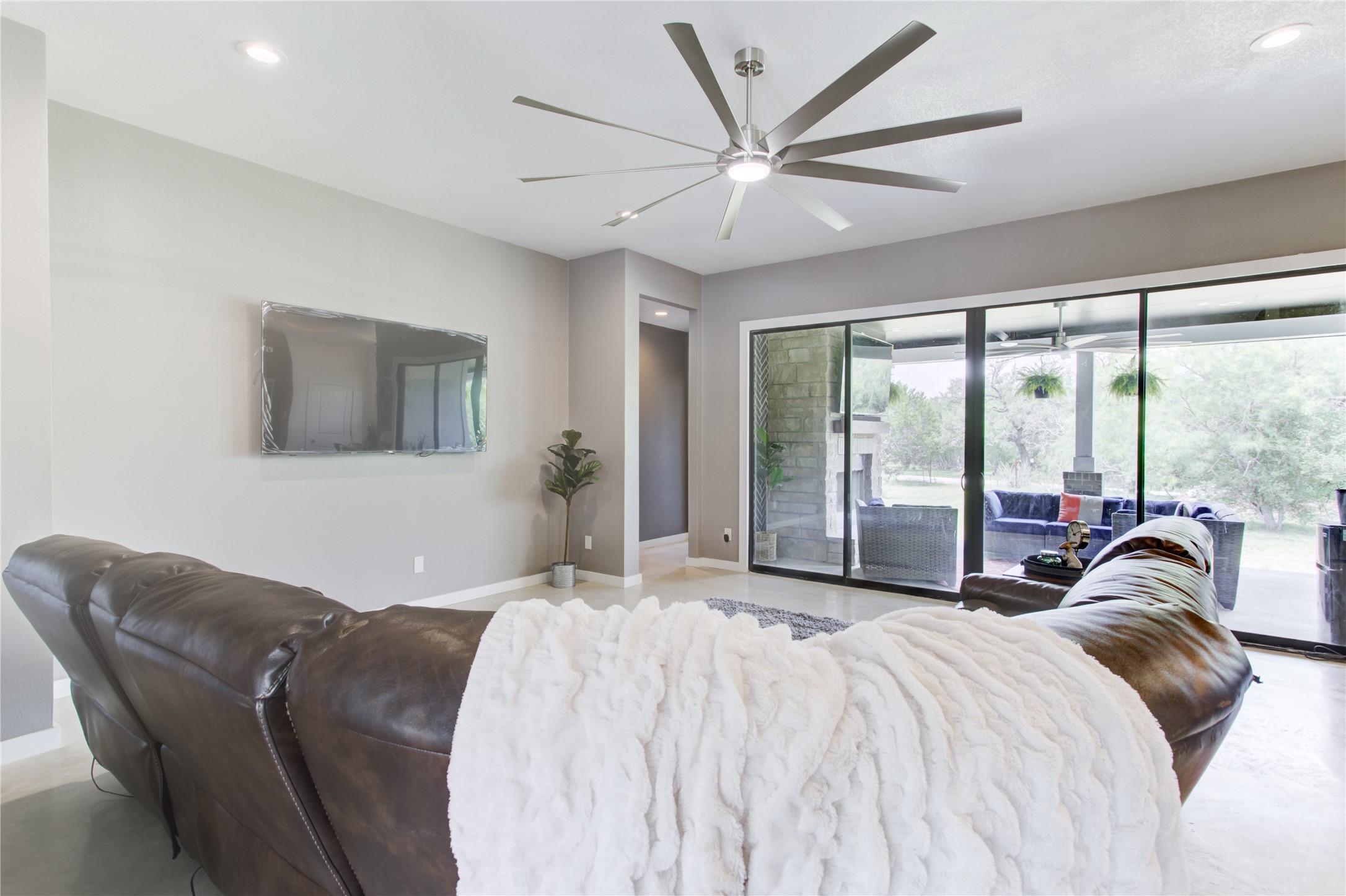 1215 Ridge Harbor Drive Spicewood, TX 78669 - Photo 9 of 39 a bedroom with a bed and a large window