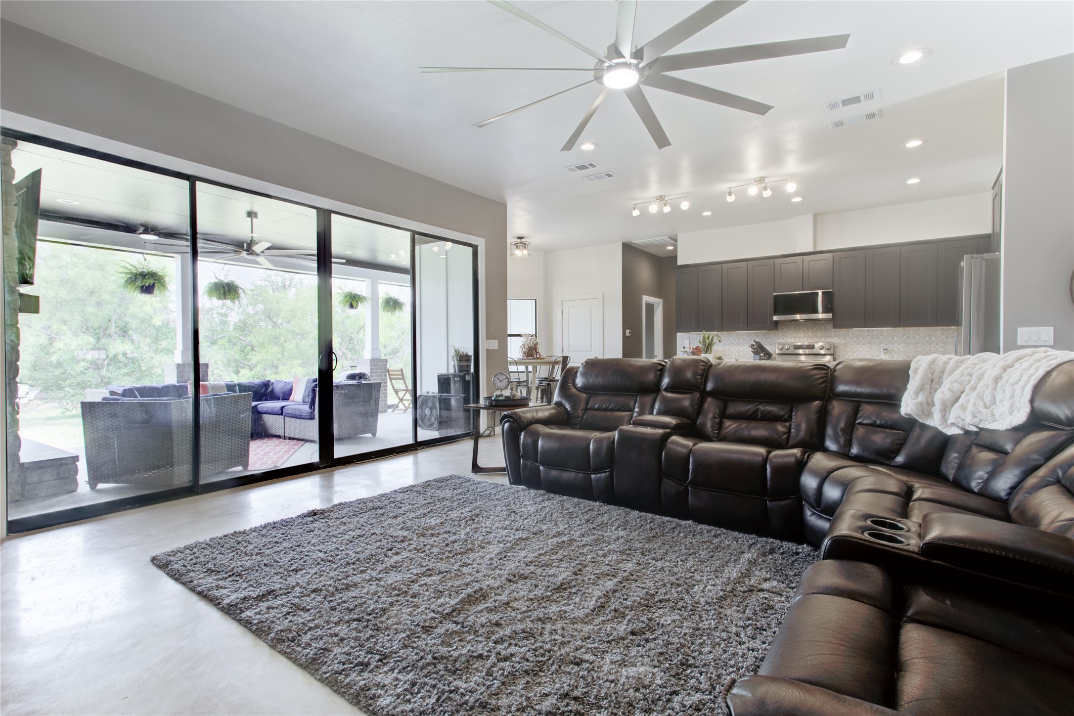 1215 Ridge Harbor Drive Spicewood, TX 78669 - Photo 10 of 39 a living room with furniture and a large window