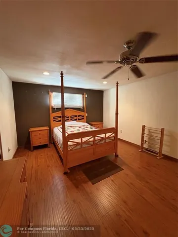 a room with furniture and a wooden floor