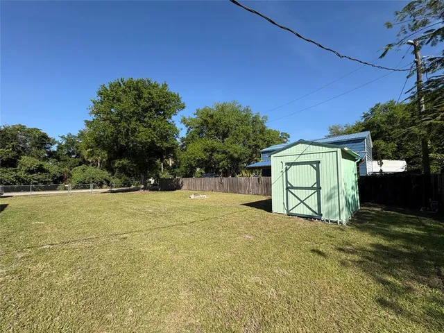 a view of a yard with a house