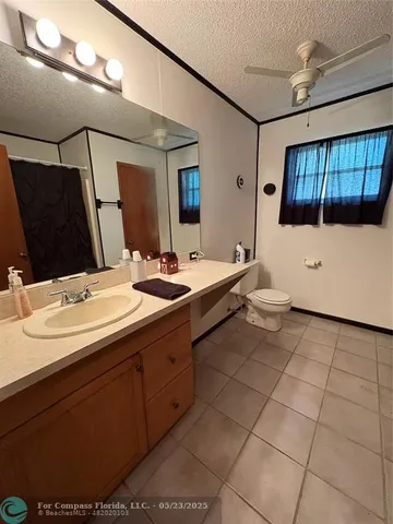 a bathroom with a double vanity sink a mirror and shower