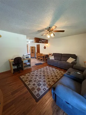 a living room with furniture and a rug