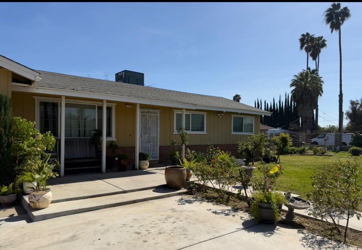 708 Avon Street Modesto, CA 95351 - Photo 1 of 1 a front view of a house with a garden