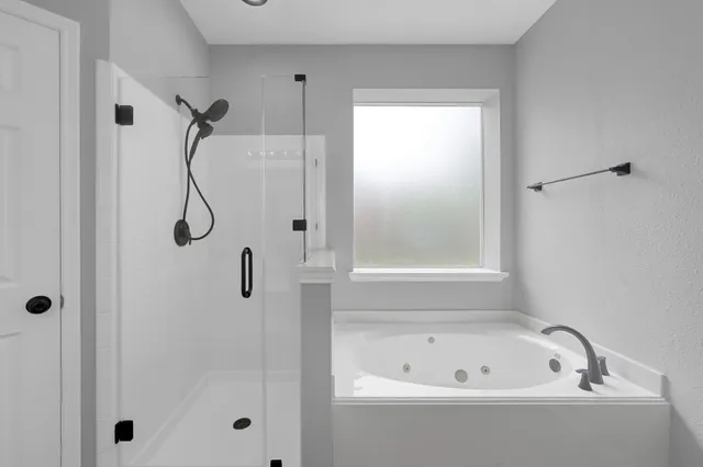 a bathroom with a sink a mirror and a bathtub