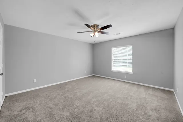 a view of swimming pool with outdoor seating and plants