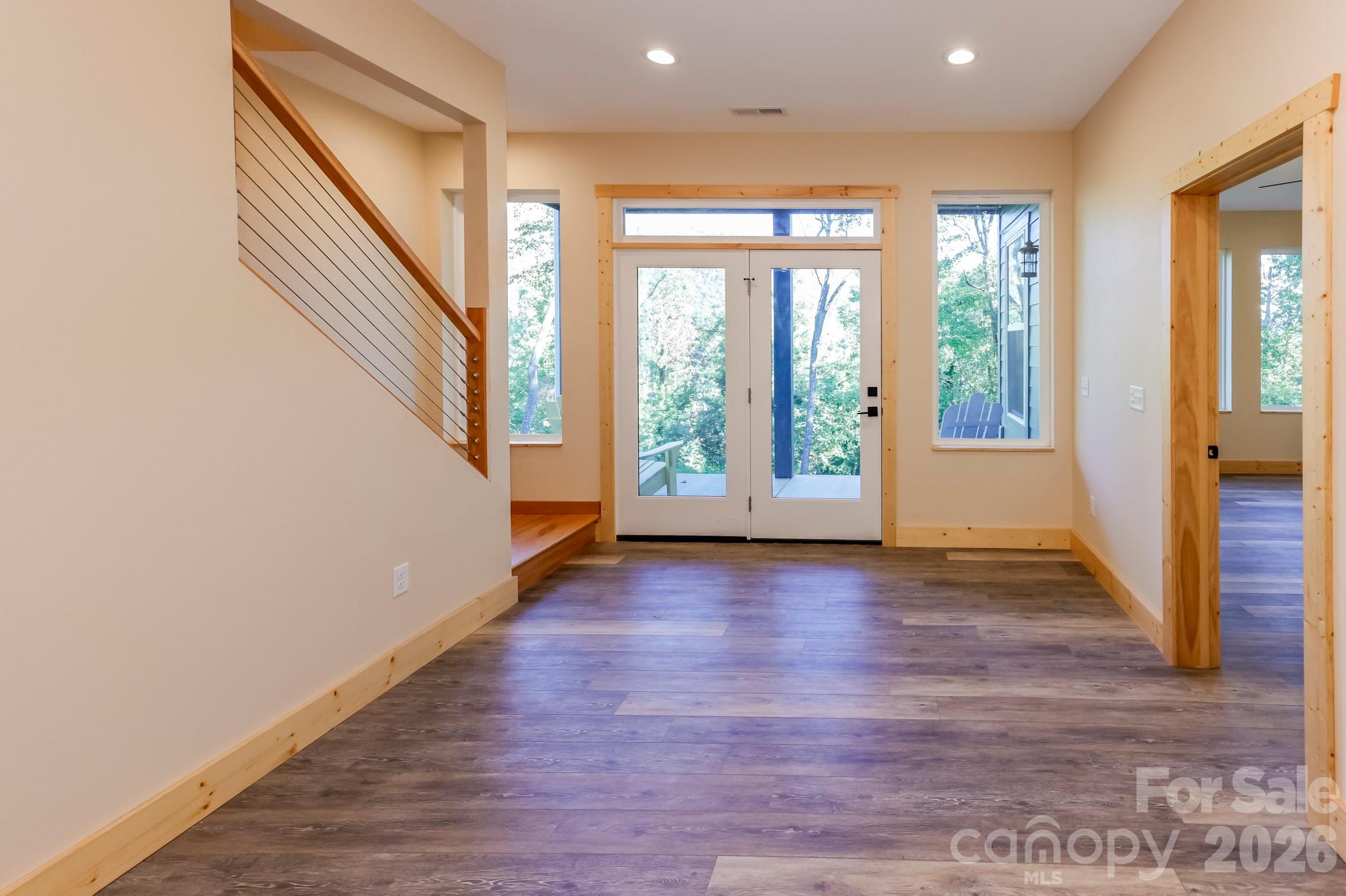 272 Seton Road Lake Lure, NC 28746 - Photo 20 of 39 a view of an entryway with wooden floor and door