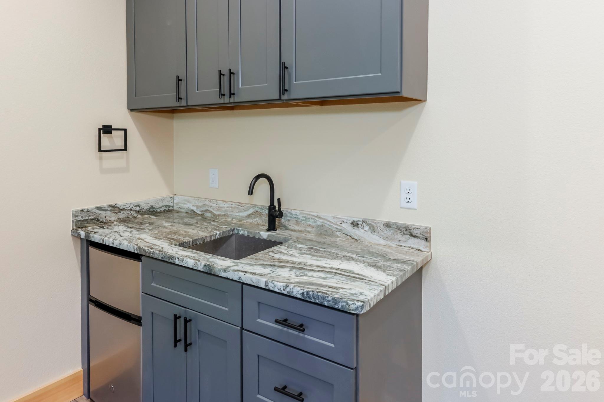 272 Seton Road Lake Lure, NC 28746 - Photo 22 of 39 a view of a sink and cabinets