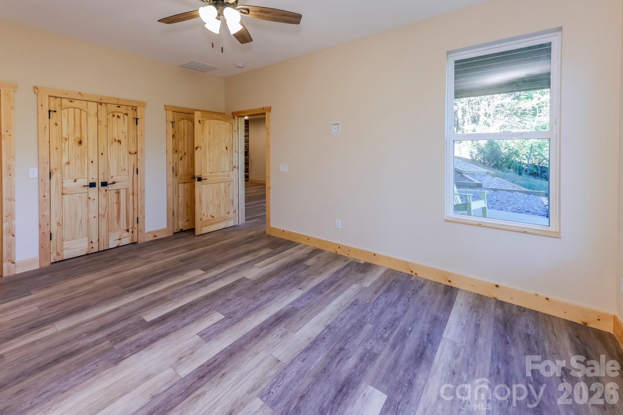 272 Seton Road Lake Lure, NC 28746 - Photo 23 of 39 a view of a room with wooden floor and a window