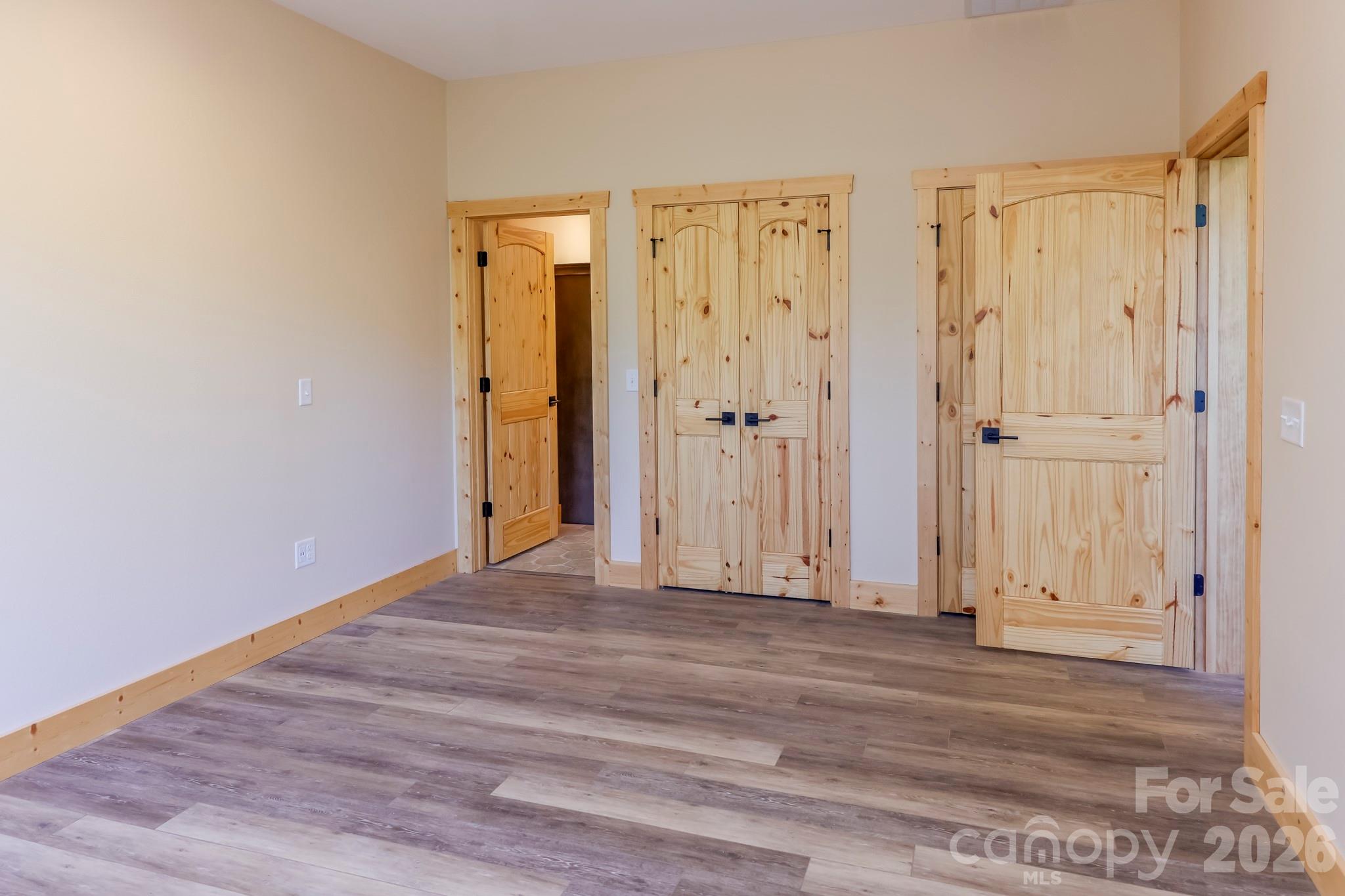 272 Seton Road Lake Lure, NC 28746 - Photo 26 of 39 a view of wooden floor and an entryway in a room