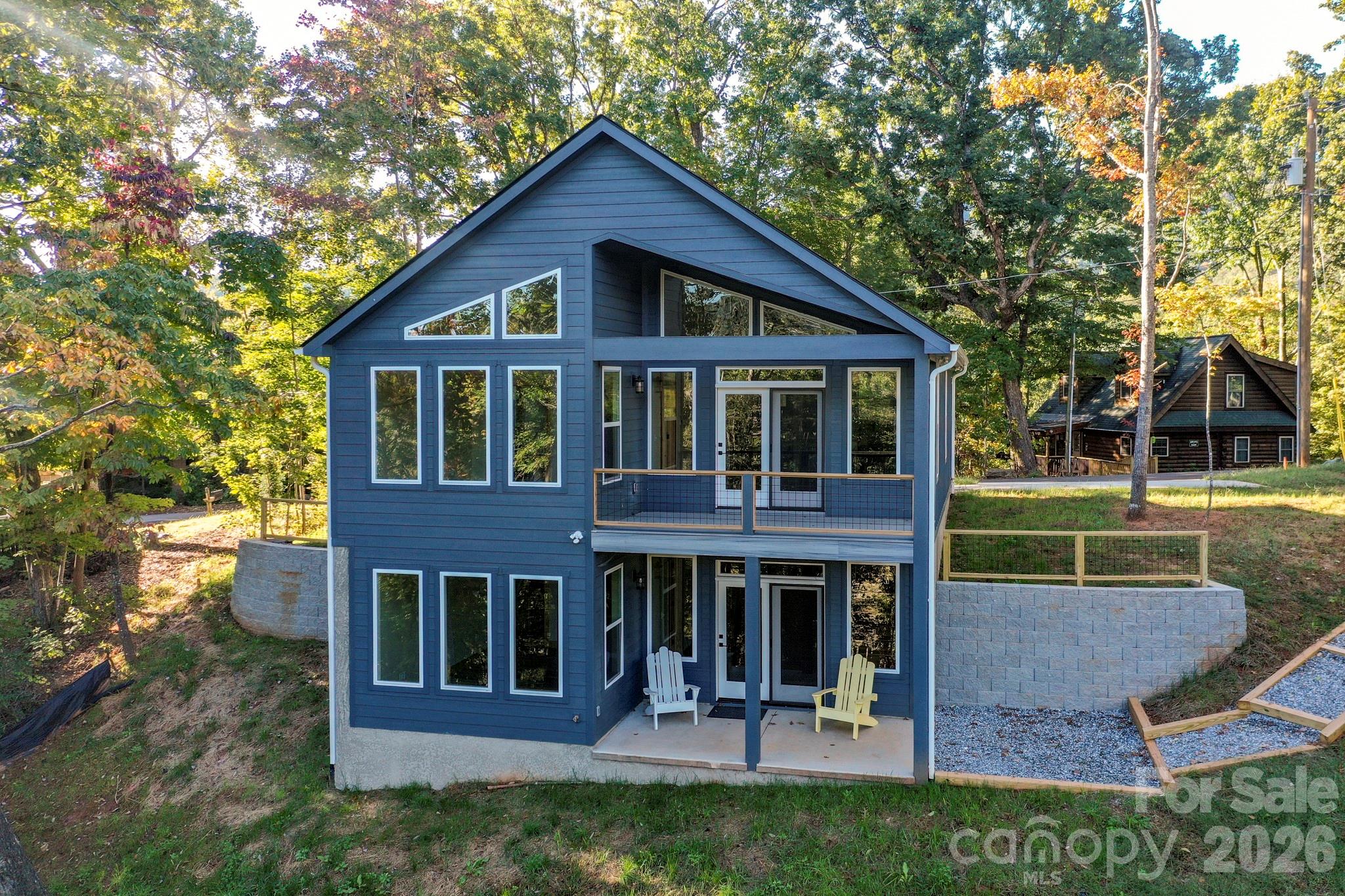 272 Seton Road Lake Lure, NC 28746 - Photo 35 of 39 a view of house with a yard