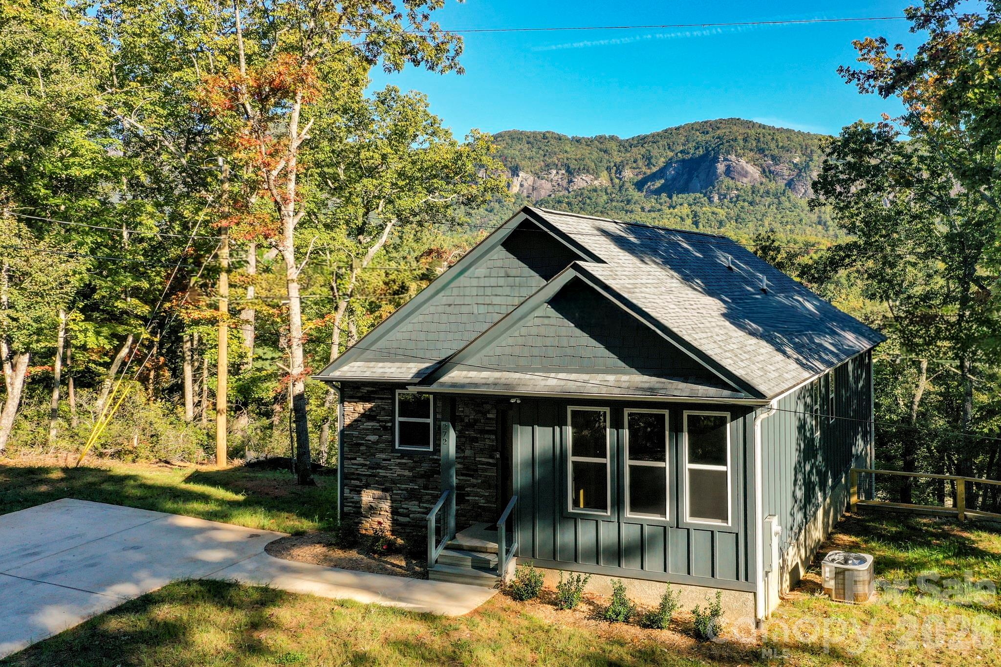 272 Seton Road Lake Lure, NC 28746 - Photo 37 of 39 a front view of a house with a yard