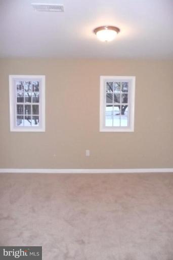 3717 Ridgecroft Road Baltimore, MD 21206 - Photo 11 of 17 an empty room with windows