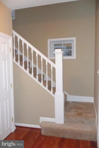 3717 Ridgecroft Road Baltimore, MD 21206 - Photo 14 of 17 a view of an empty room with wooden floor