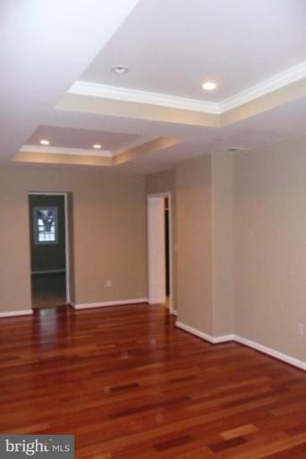 3717 Ridgecroft Road Baltimore, MD 21206 - Photo 6 of 17 a view of an empty room with wooden floor and closet