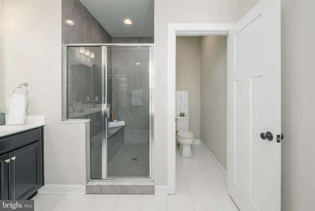 a bathroom with a shower and a sink