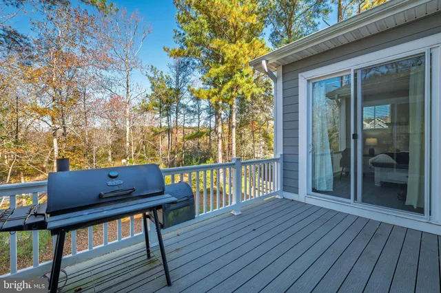 a view of wooden deck with a bench