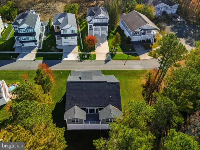 an aerial view of a house with a ocean view