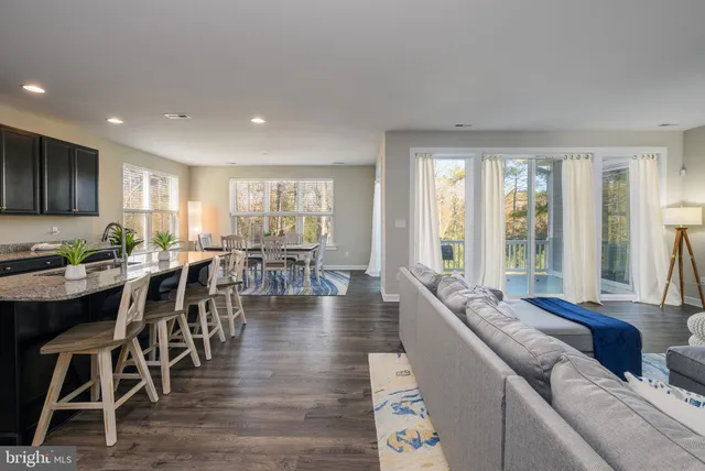 a kitchen with stainless steel appliances granite countertop a sink counter space and cabinets