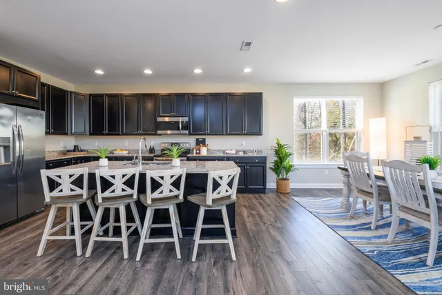 a spacious bedroom with a bed and a table