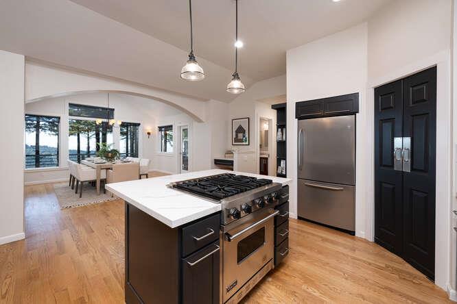 108 Ware Road Woodside, CA 94062 - Photo 16 of 56 a kitchen with a stove a refrigerator and a fireplace