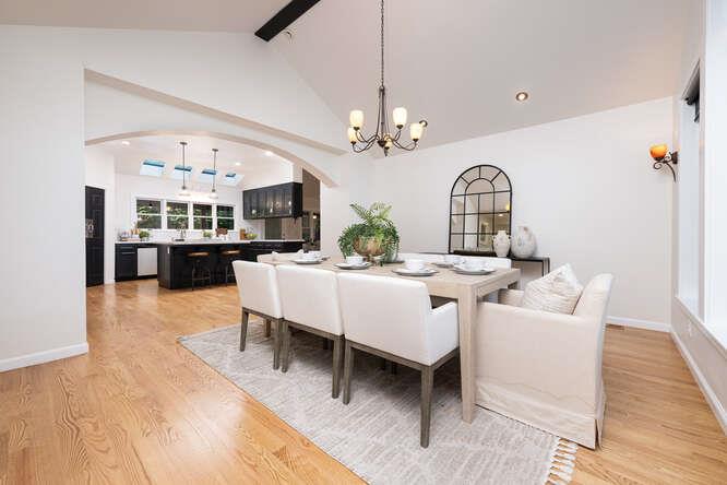 108 Ware Road Woodside, CA 94062 - Photo 18 of 56 a living room with fireplace furniture chandelier and a view of kitchen