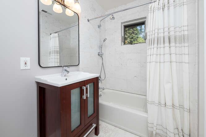 108 Ware Road Woodside, CA 94062 - Photo 33 of 56 a bathroom with a bathtub a sink and a mirror
