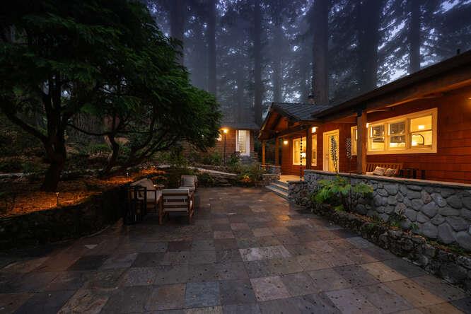108 Ware Road Woodside, CA 94062 - Photo 4 of 56 a view of a patio with table and chairs with wooden fence and plants
