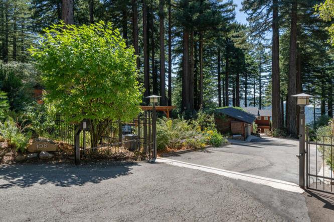 108 Ware Road Woodside, CA 94062 - Photo 43 of 56 a view of a street with potted plants and large trees