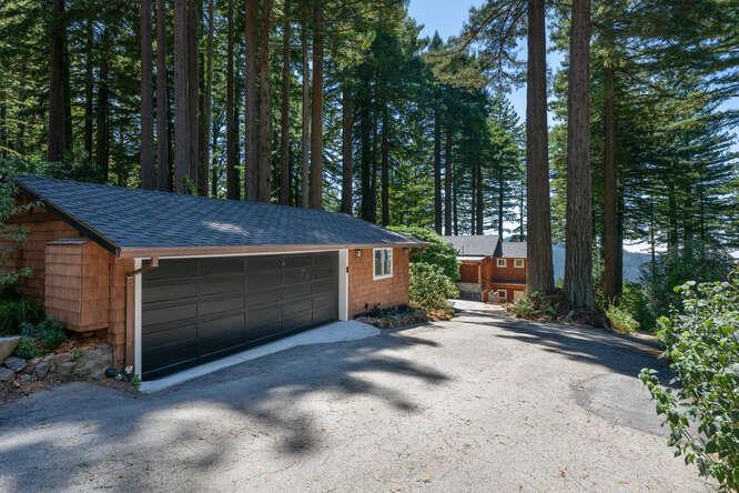108 Ware Road Woodside, CA 94062 - Photo 44 of 56 a view of a barn in the backyard of a house