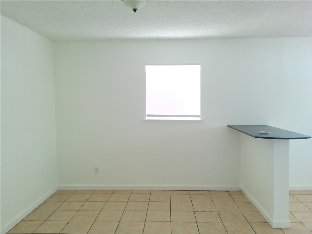 2701 Nemec Street, Unit 3 Corpus Christi, TX 78415 - Photo 6 of 11 a view of an empty room with a window