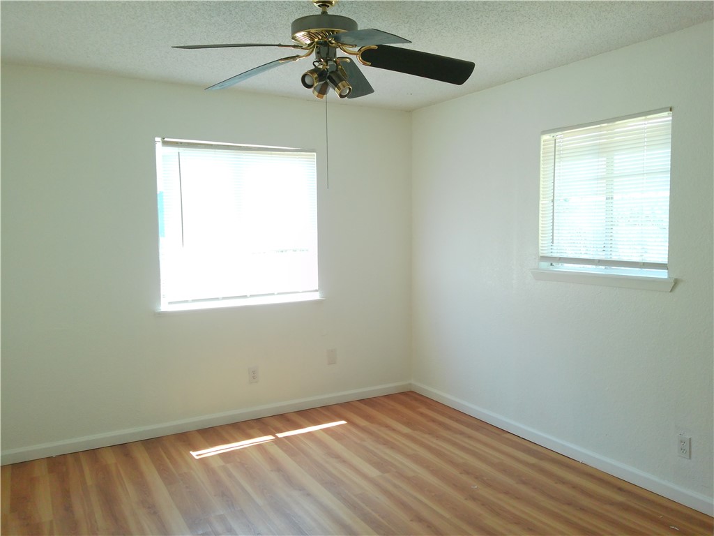 2701 Nemec Street, Unit 3 Corpus Christi, TX 78415 - Photo 7 of 11 an empty room with a window