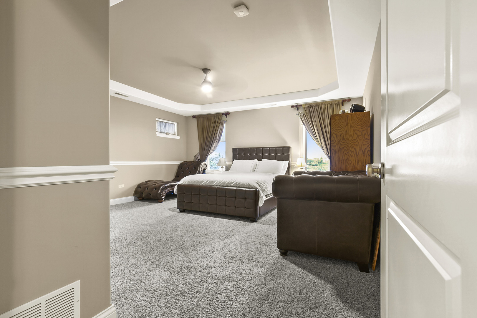 401 West Pierce Road, Unit 201 Itasca, IL 60143 - Photo 12 of 24 a bedroom with a bed and a couch
