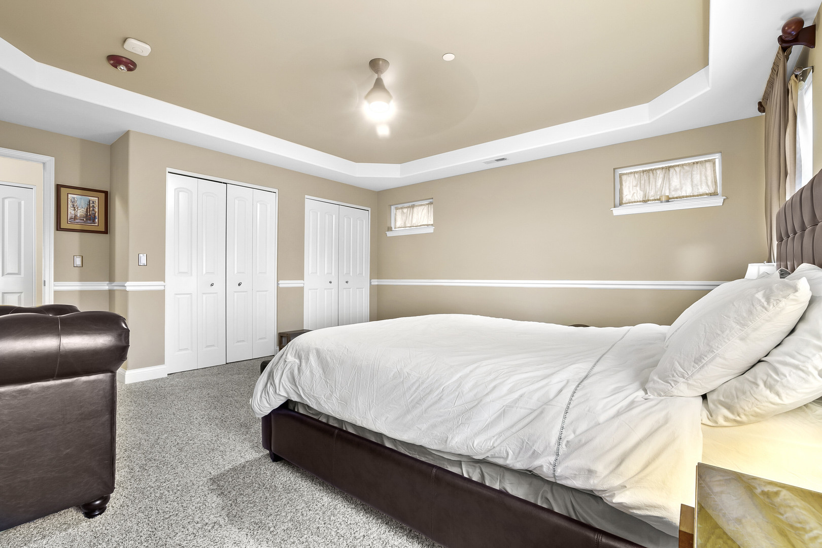 401 West Pierce Road, Unit 201 Itasca, IL 60143 - Photo 14 of 24 a bedroom with a bed and couch