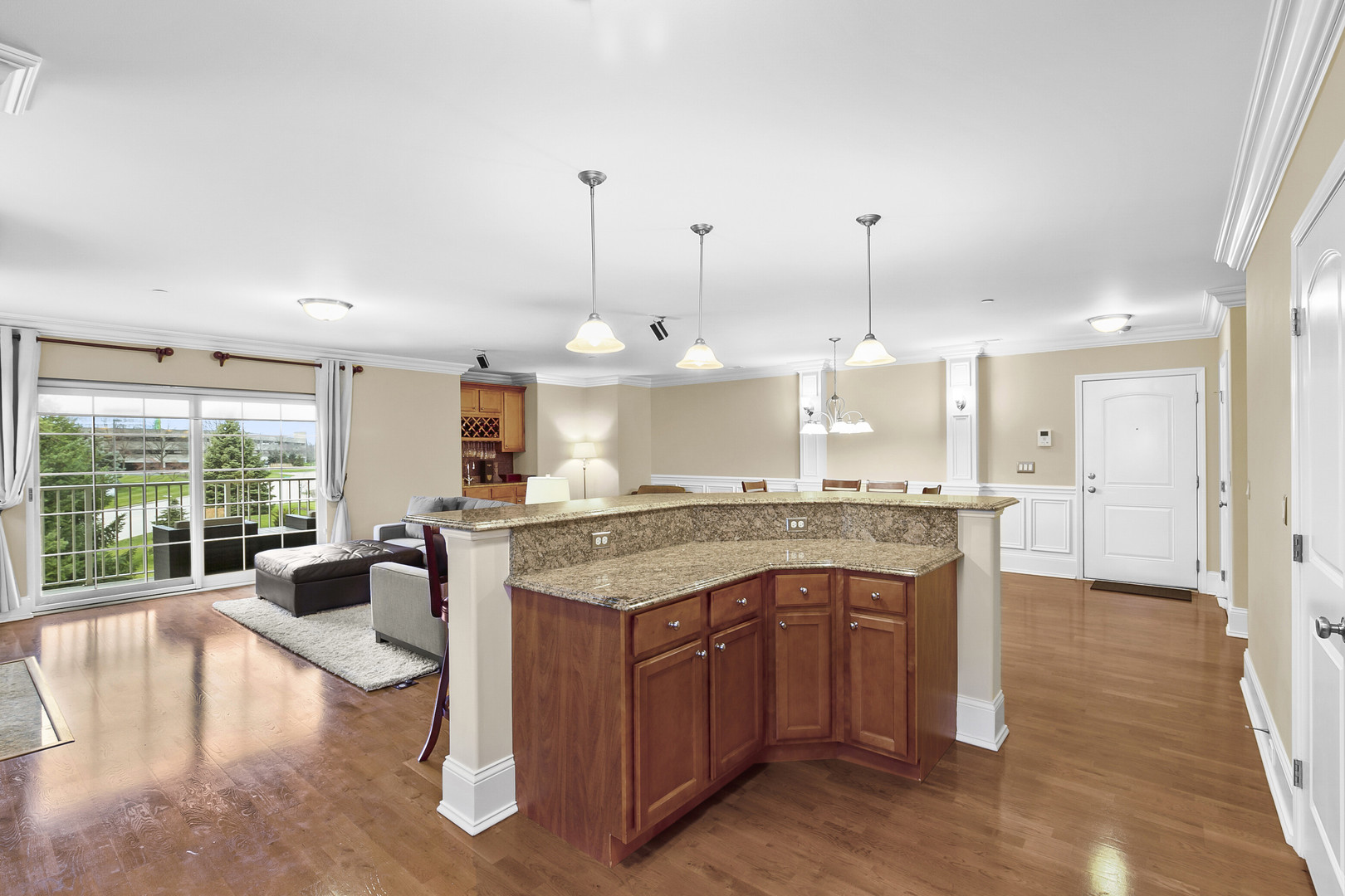 401 West Pierce Road, Unit 201 Itasca, IL 60143 - Photo 8 of 24 a large kitchen with kitchen island a large counter top space a sink stainless steel appliances and cabinets