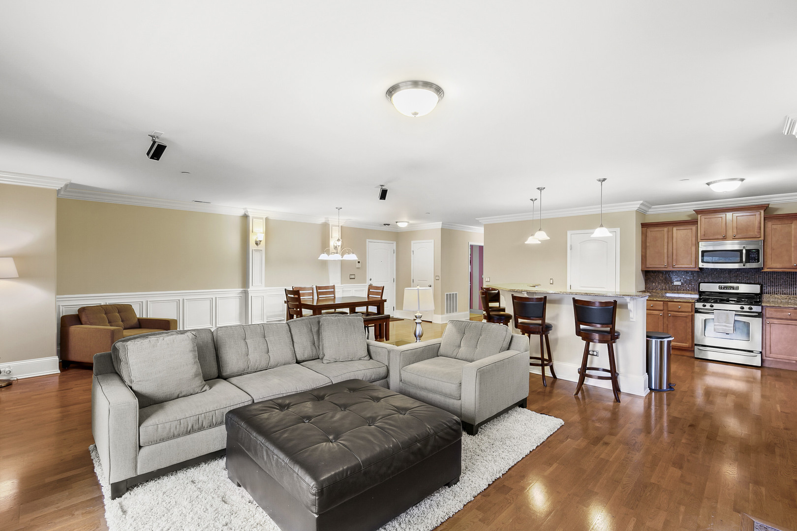 401 West Pierce Road, Unit 201 Itasca, IL 60143 - Photo 9 of 24 a living room with furniture and wooden floor