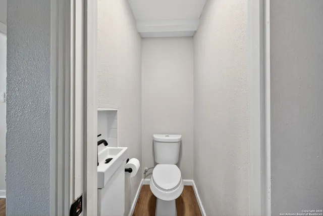 a bathroom with a toilet and a sink