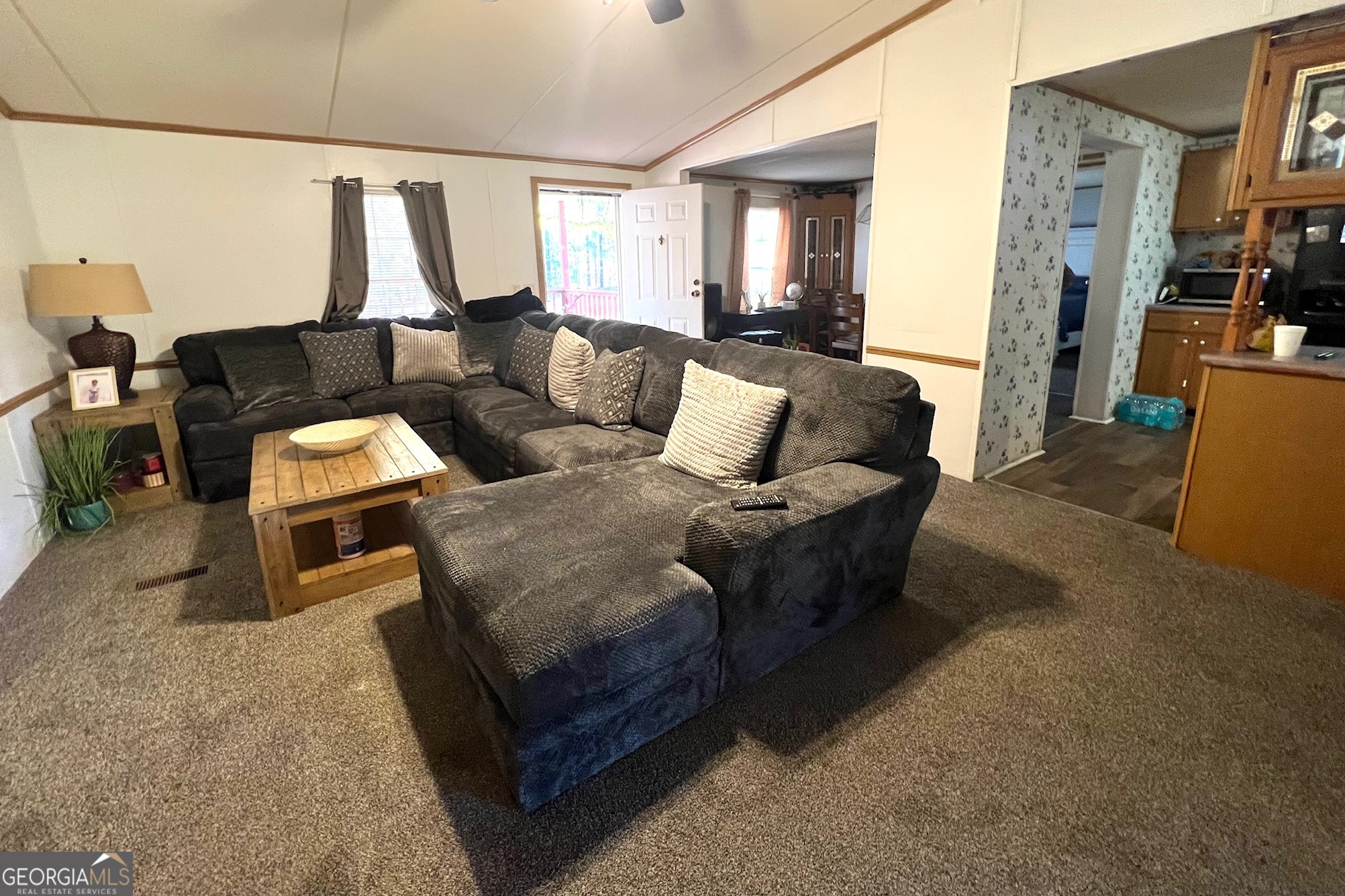 3195 Henderson Grove Road Sandersville, GA 31082 - Photo 11 of 50 a living room with furniture and a window