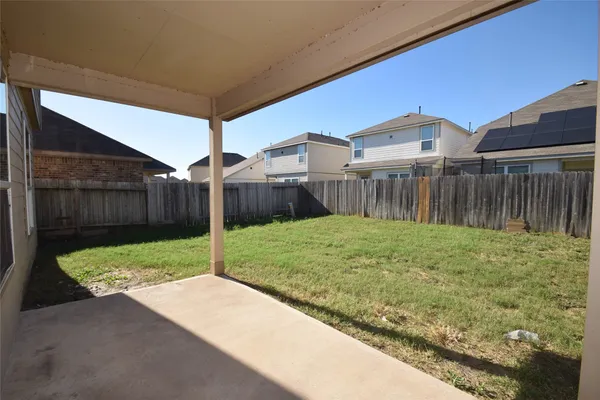 a house view with a backyard space