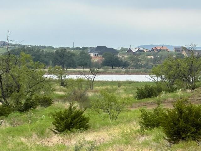 a view of lake with green space