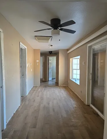 a view of an empty room and window