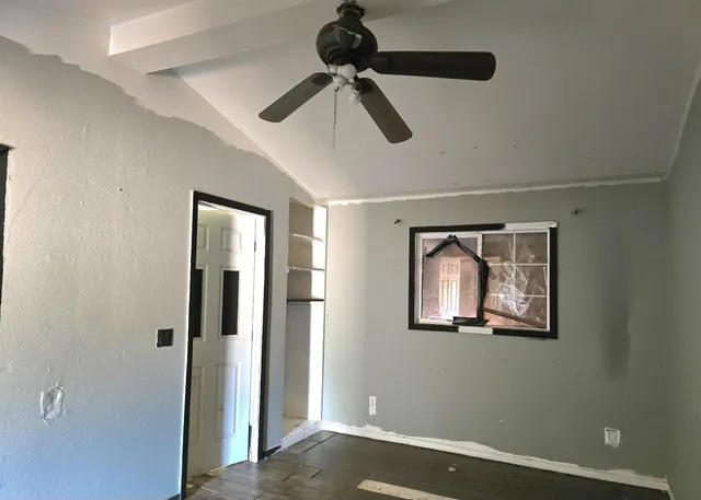 a white toilet sitting next to a bath tub