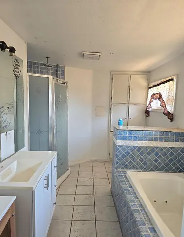 a bathroom with a bathtub and a shower