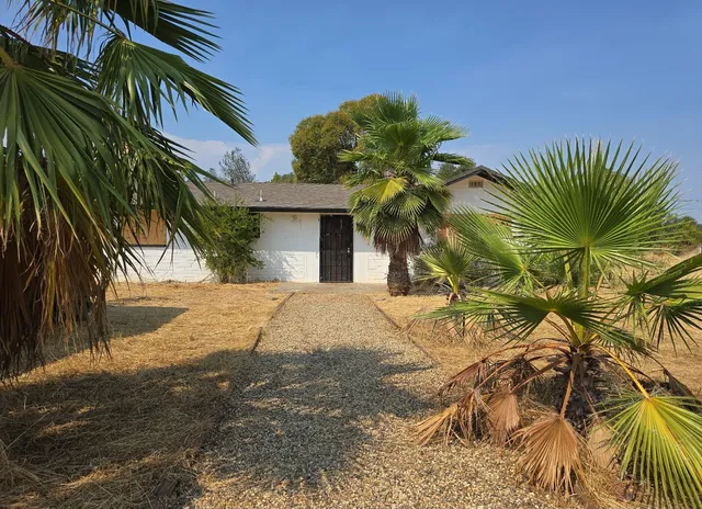 a view of a house with a street