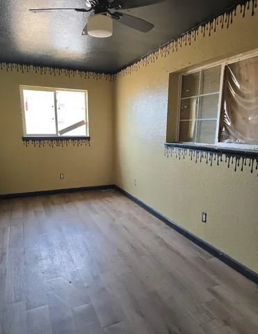 wooden floor and window in an empty room